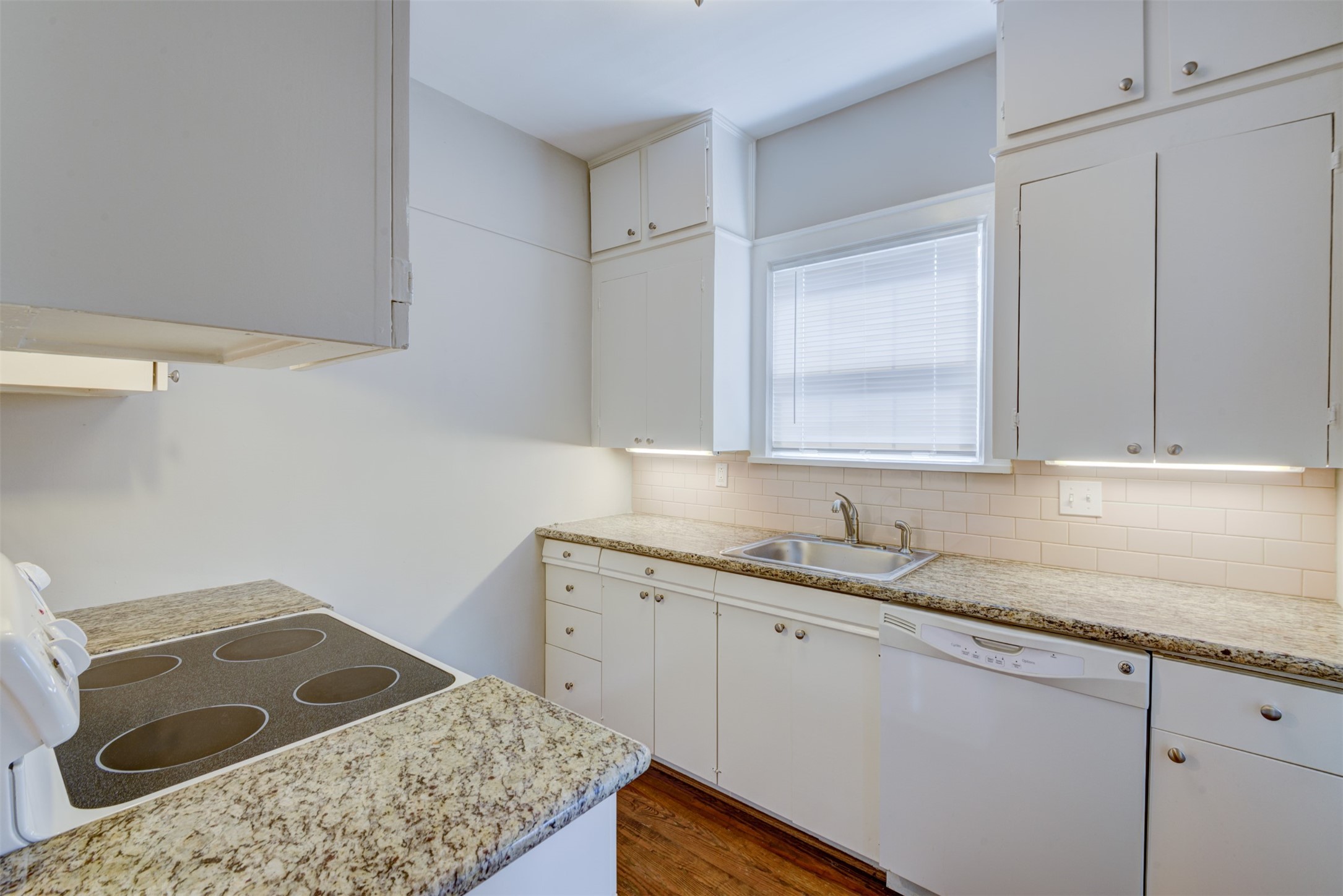 1313 Peden Street Houston, TX 77006 - Photo 29 of 33 a kitchen with a sink stove and cabinets