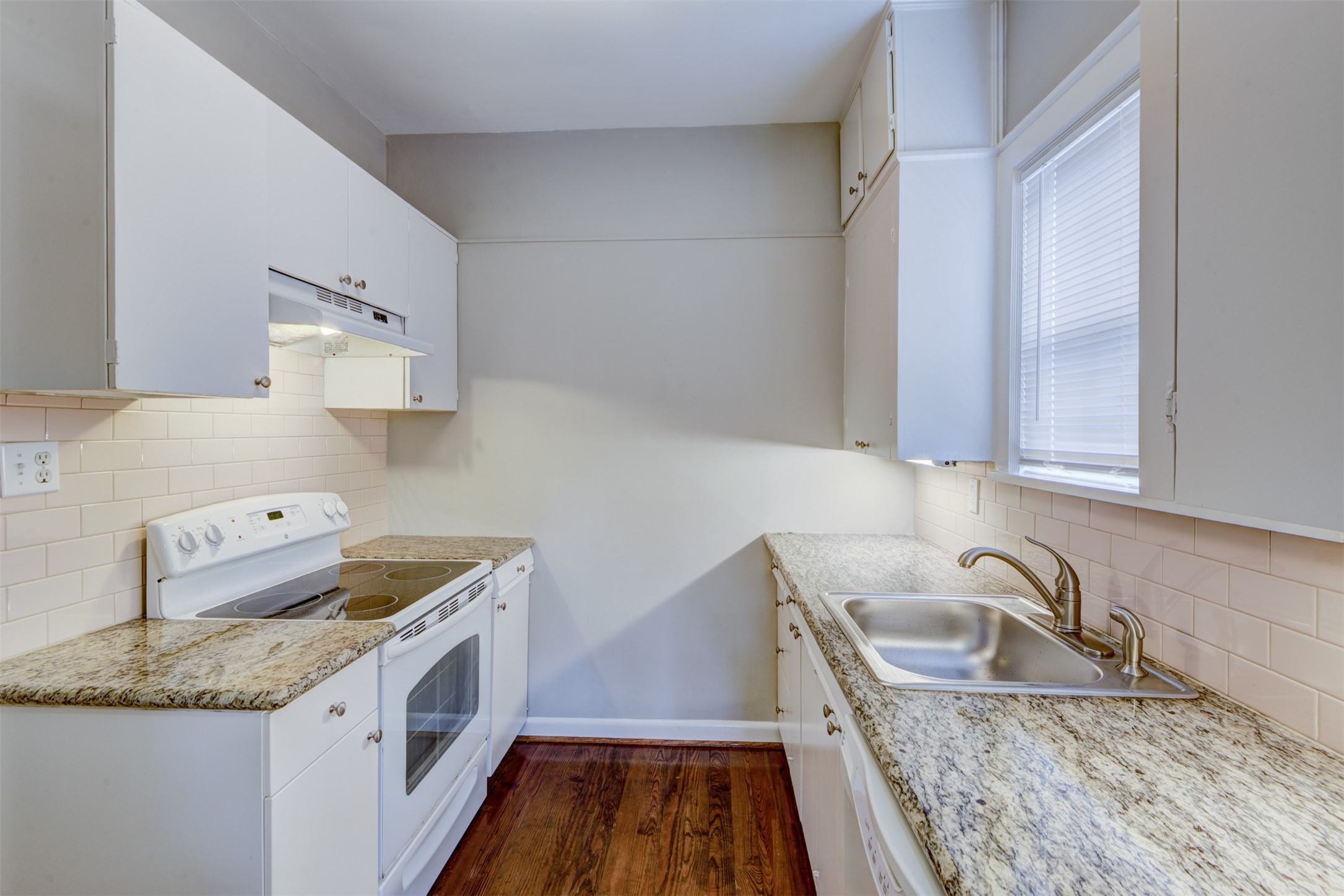 1313 Peden Street Houston, TX 77006 - Photo 30 of 33 a kitchen with stainless steel appliances granite countertop a sink stove and refrigerator