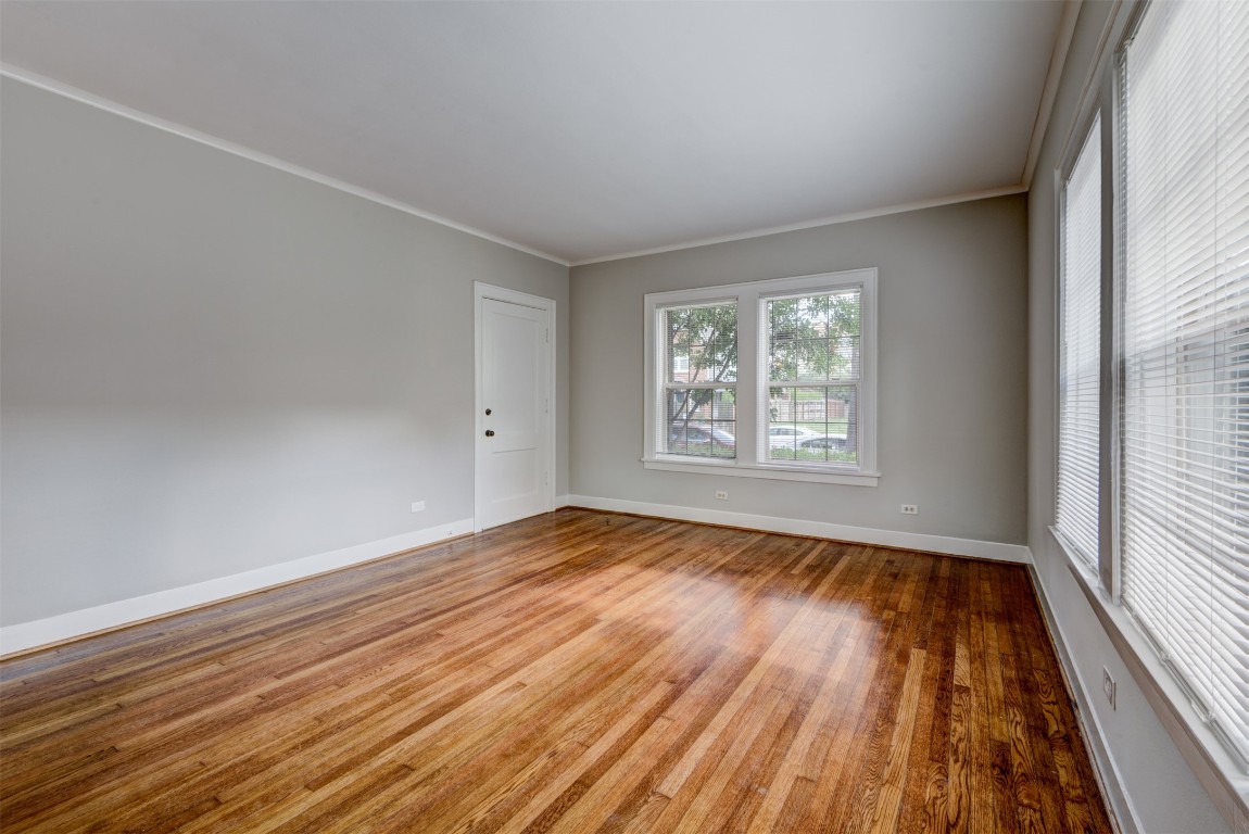 1313 Peden Street Houston, TX 77006 - Photo 31 of 33 wooden floor in an empty room with a window