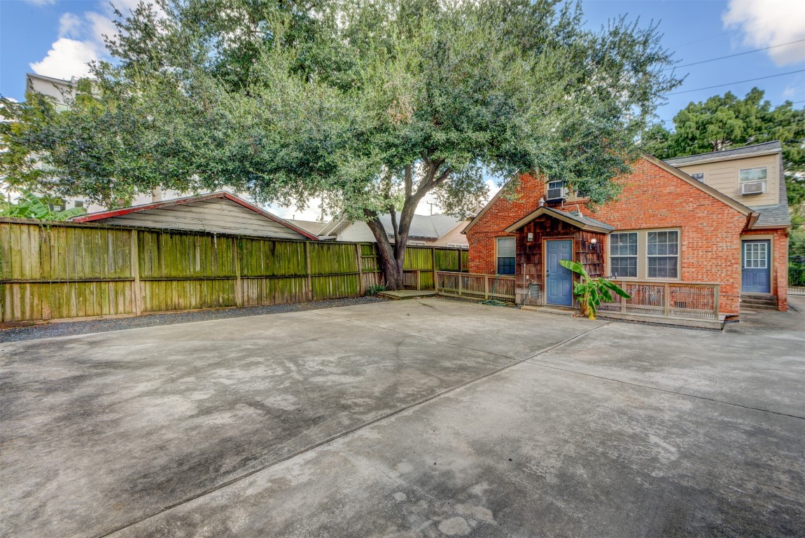 1313 Peden Street Houston, TX 77006 - Photo 5 of 33 a view of a house with a yard and large tree