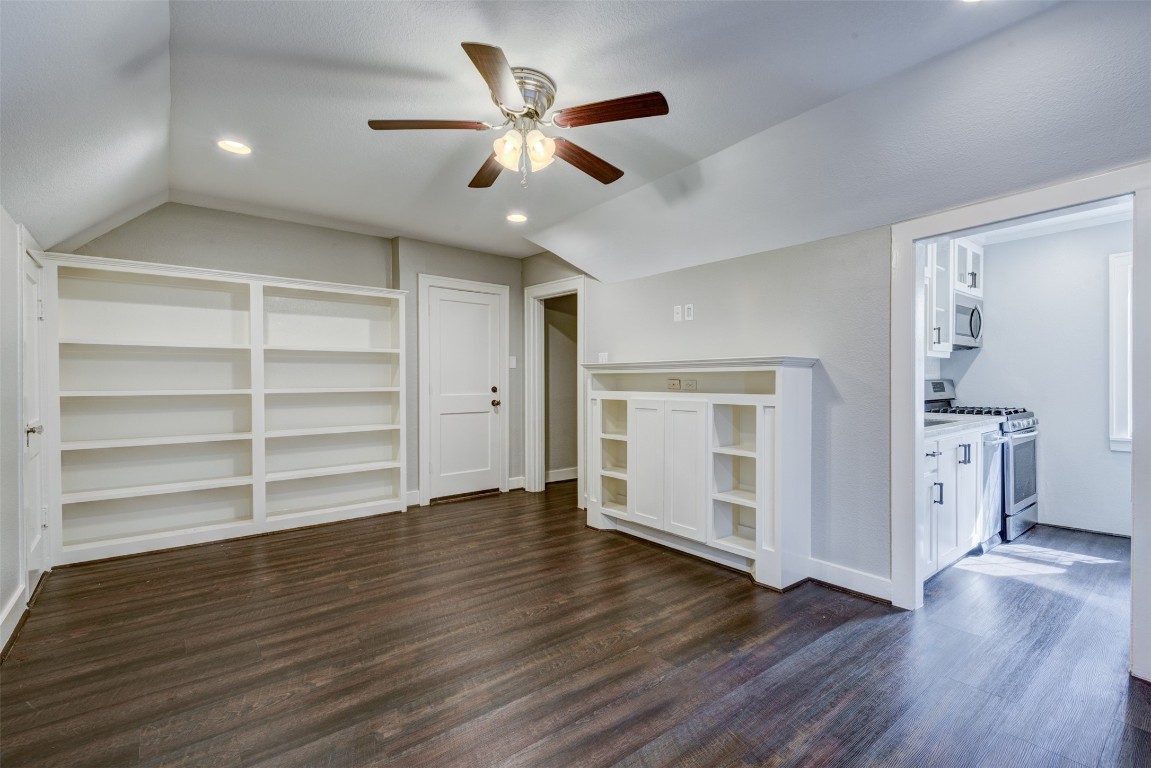 1313 Peden Street Houston, TX 77006 - Photo 7 of 33 a view of an empty room with a window and wooden floor