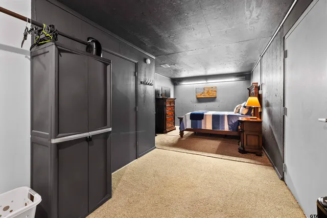 a view of a hallway with wooden floor and furniture