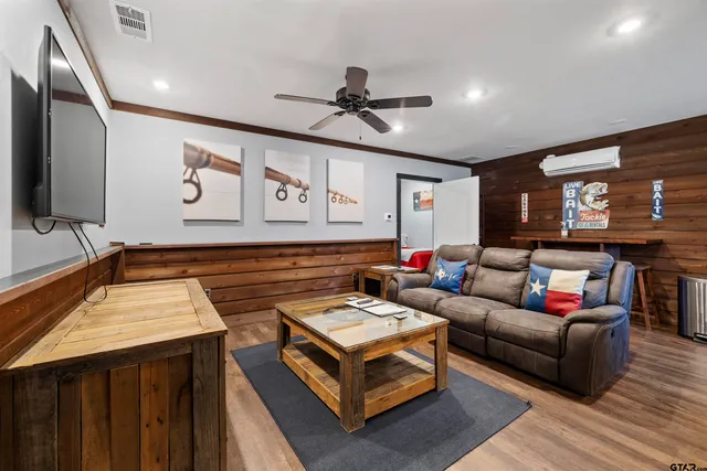 a living room with furniture and a flat screen tv