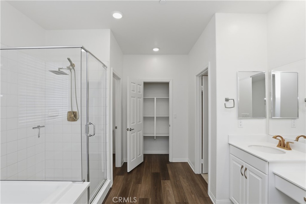 21159 Blue Jeans Court Riverside, CA 92507 - Photo 40 of 63 a bathroom with a sink and shower