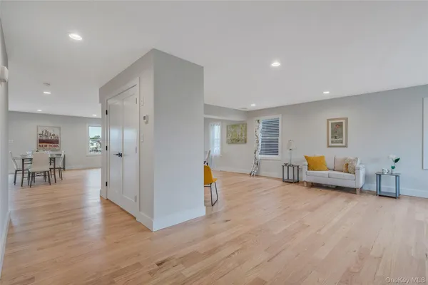a view of living room with furniture and wooden floor