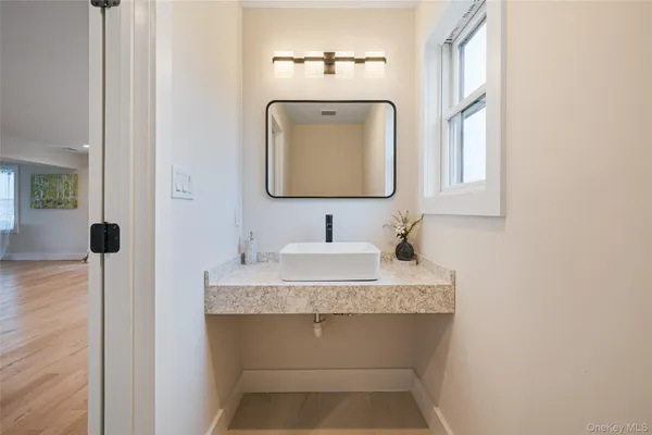 a bathroom with a sink and a mirror