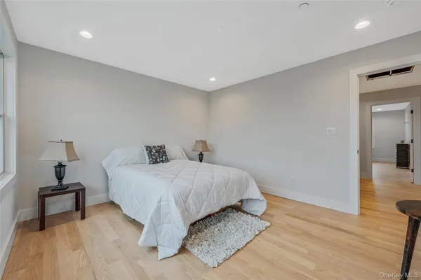 a bed room with a bed and a night stand