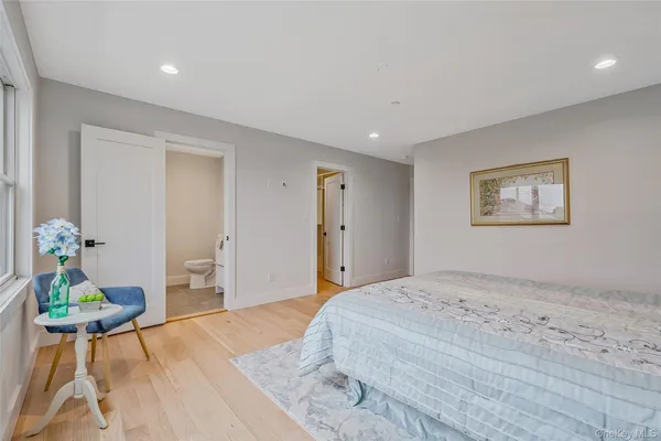 a bedroom with a bed and a table