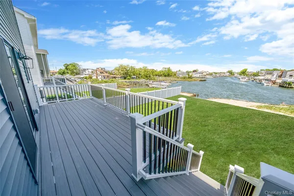 a view of a balcony with wooden floor