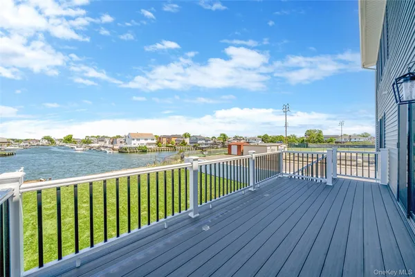 a view of a balcony with wooden floor