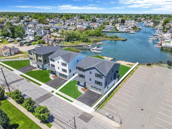 an aerial view of a house with a ocean view