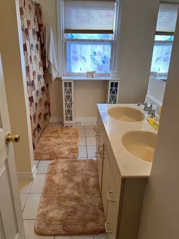 a bathroom with a sink and mirror