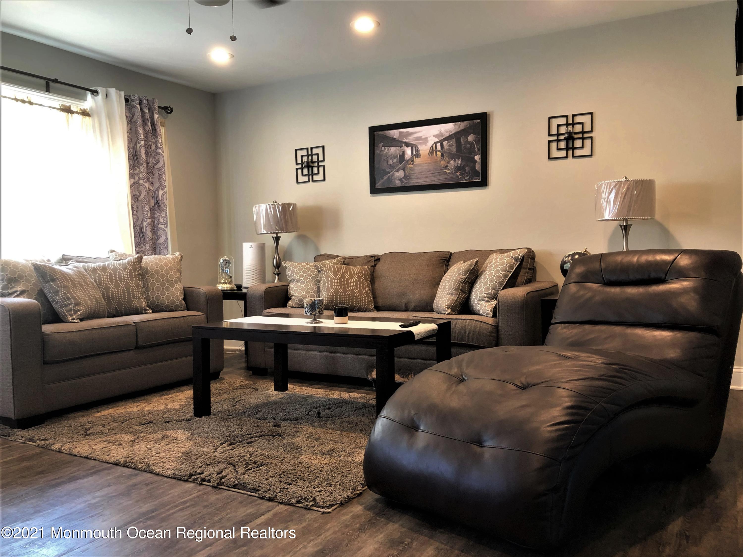 836 Wright Debow Road Jackson, NJ 08527 - Photo 2 of 22 a living room with furniture and a couch