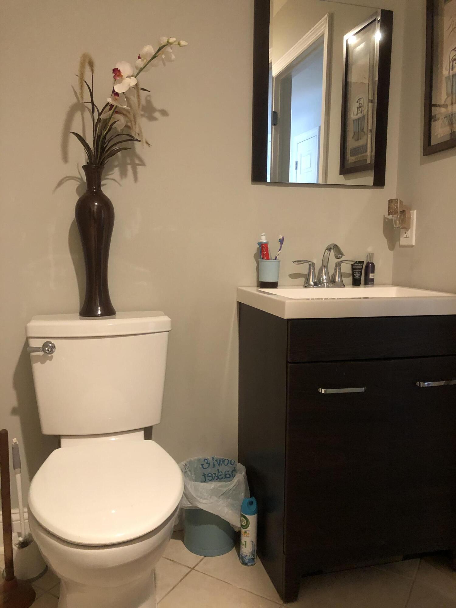 836 Wright Debow Road Jackson, NJ 08527 - Photo 12 of 22 a bathroom with a toilet a sink and mirror