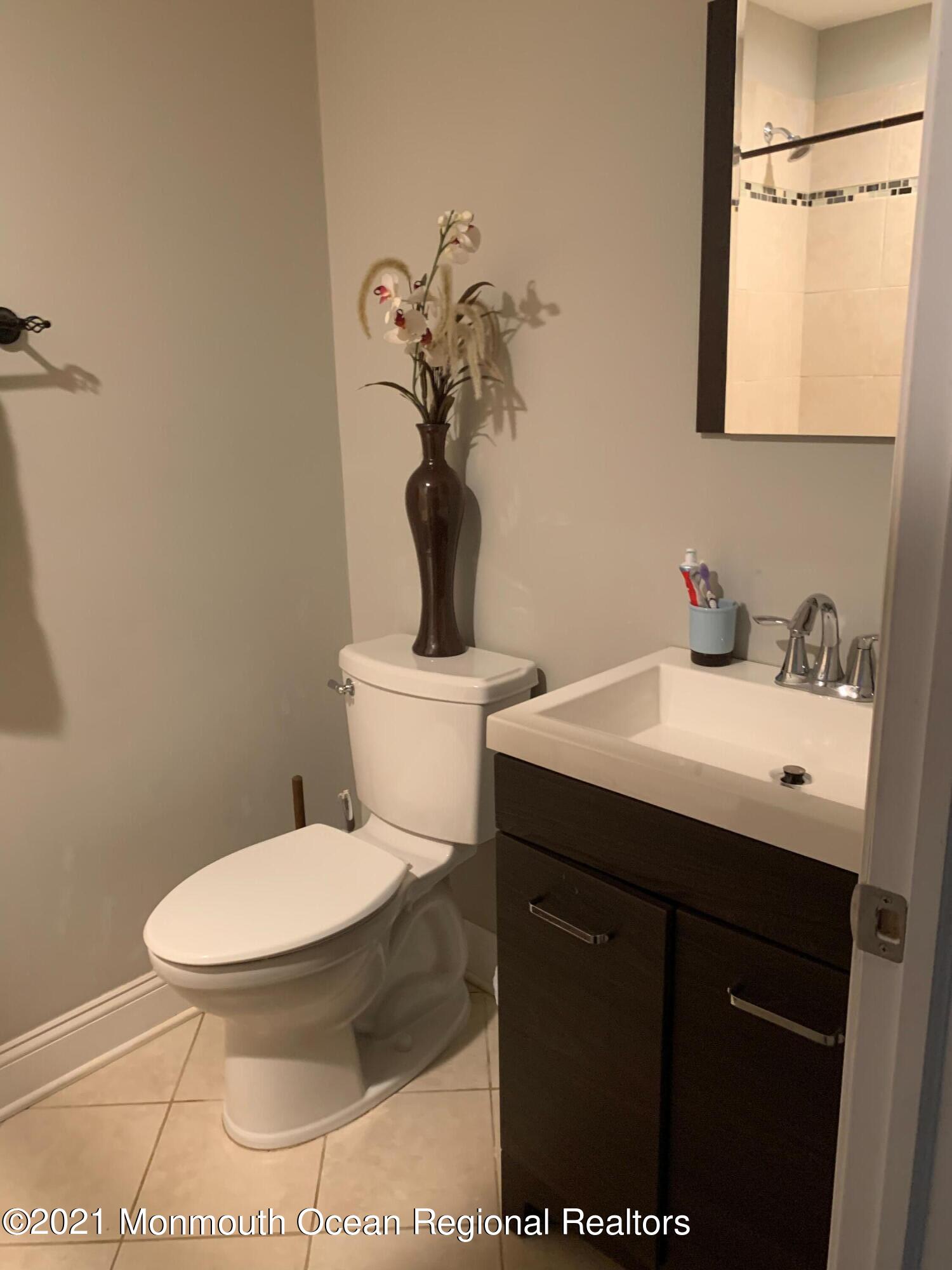 836 Wright Debow Road Jackson, NJ 08527 - Photo 14 of 22 a bathroom with a sink toilet and a mirror