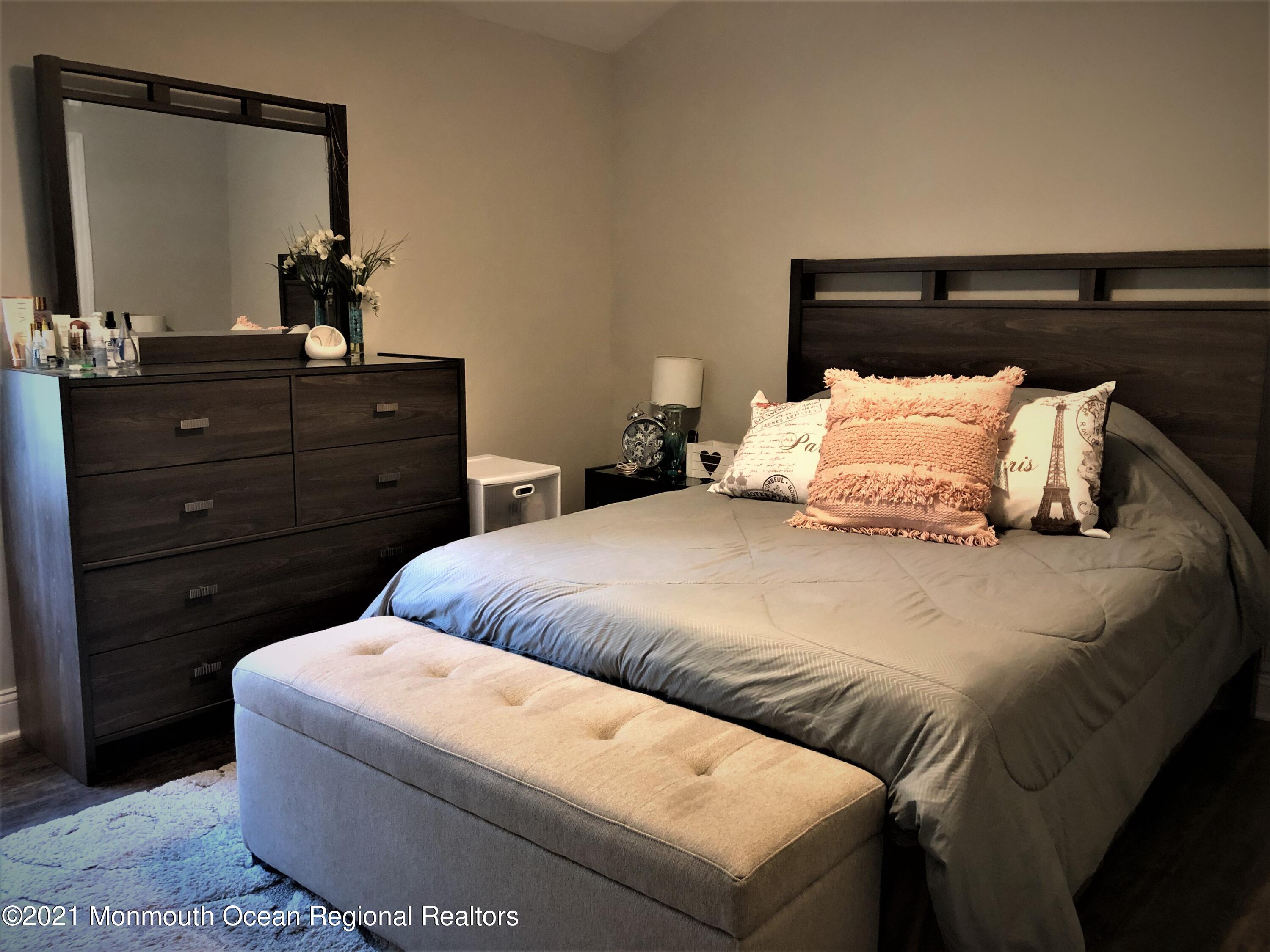 836 Wright Debow Road Jackson, NJ 08527 - Photo 15 of 22 a bedroom with a bed and a mirror on dresser