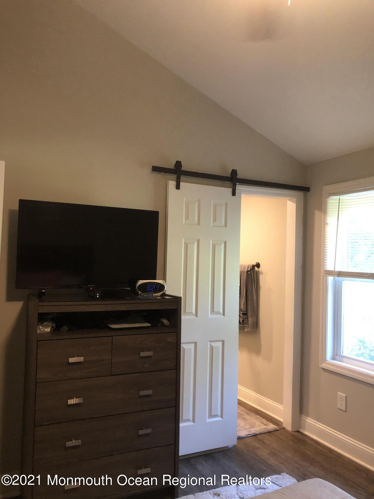 836 Wright Debow Road Jackson, NJ 08527 - Photo 17 of 22 a living room with furniture and a flat screen tv