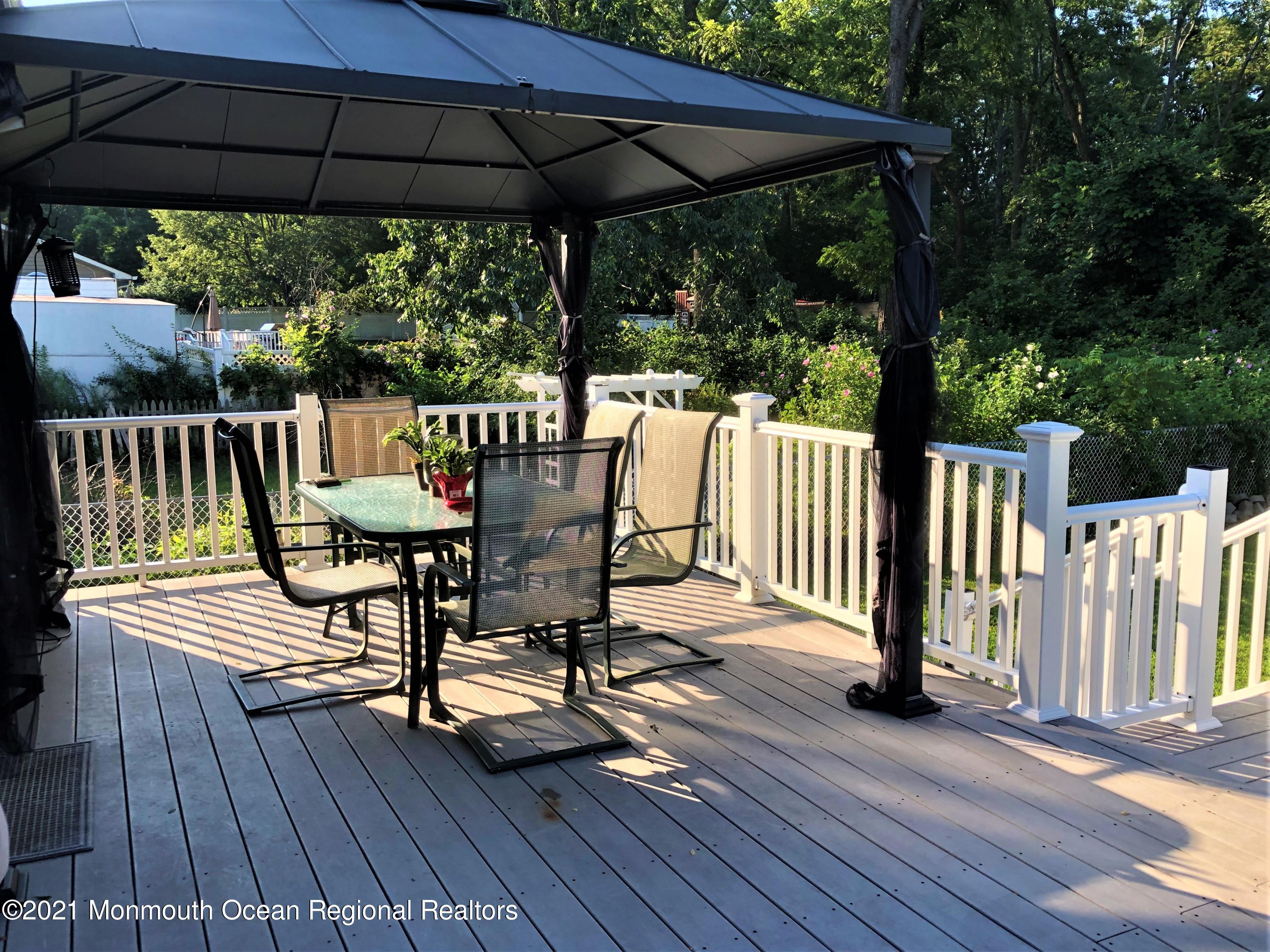 836 Wright Debow Road Jackson, NJ 08527 - Photo 20 of 22 a view of balcony with wooden floor and outdoor seating