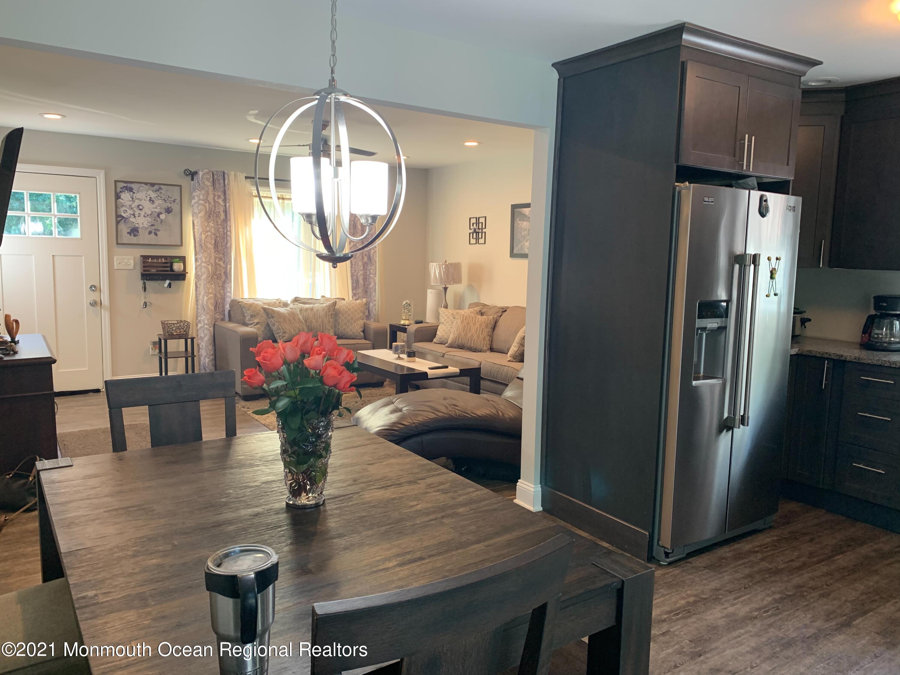 836 Wright Debow Road Jackson, NJ 08527 - Photo 3 of 22 a kitchen view with dining table and refrigerator