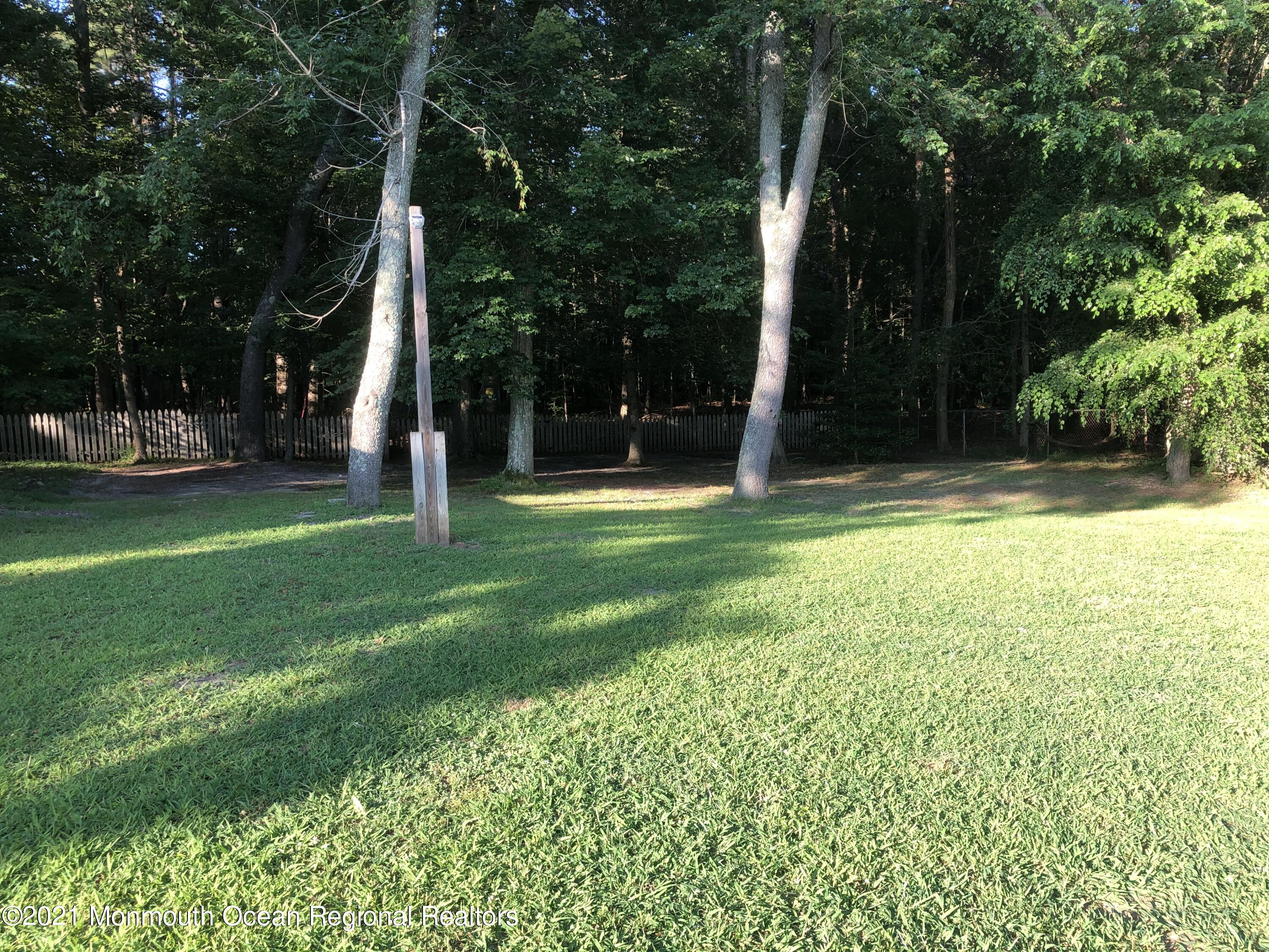 836 Wright Debow Road Jackson, NJ 08527 - Photo 22 of 22 a view of a park with swings and a slide