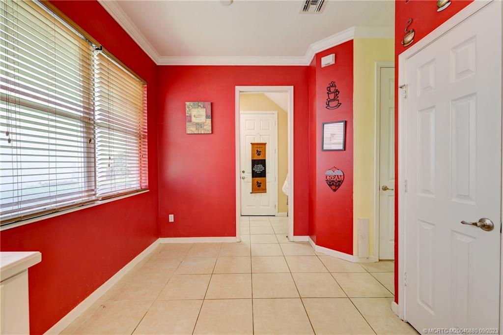 316 Southwest Otter Run Place Stuart, FL 34997 - Photo 15 of 50 a entryway with a glass door
