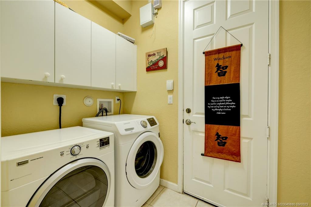 316 Southwest Otter Run Place Stuart, FL 34997 - Photo 16 of 50 a utility room with dryer and washer