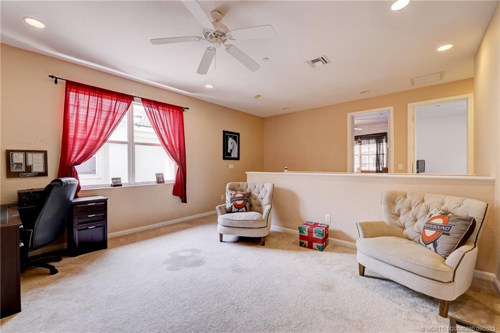 316 Southwest Otter Run Place Stuart, FL 34997 - Photo 18 of 50 a living room with furniture and a large window