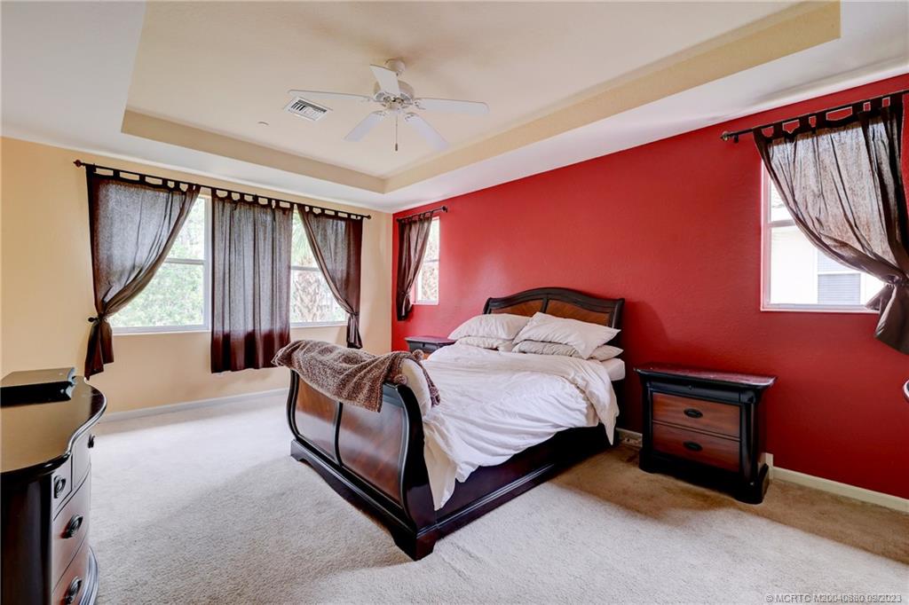 316 Southwest Otter Run Place Stuart, FL 34997 - Photo 20 of 50 a bed room with a bed and a window