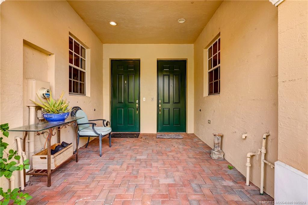 316 Southwest Otter Run Place Stuart, FL 34997 - Photo 3 of 50 a lobby with furniture and potted plants