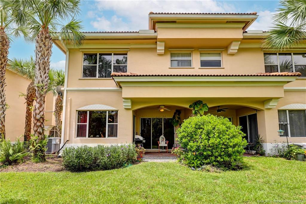 316 Southwest Otter Run Place Stuart, FL 34997 - Photo 34 of 50 front view of a house with a yard