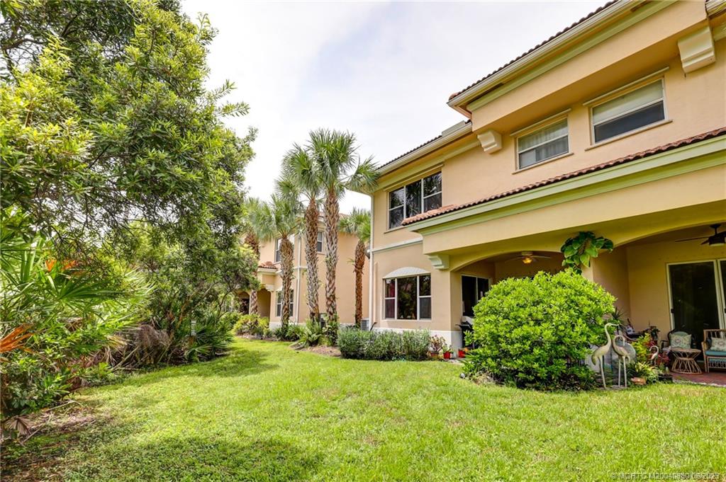 316 Southwest Otter Run Place Stuart, FL 34997 - Photo 35 of 50 a front view of a house with a yard