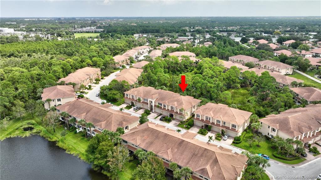 316 Southwest Otter Run Place Stuart, FL 34997 - Photo 41 of 50 an aerial view of a city with lots of residential buildings