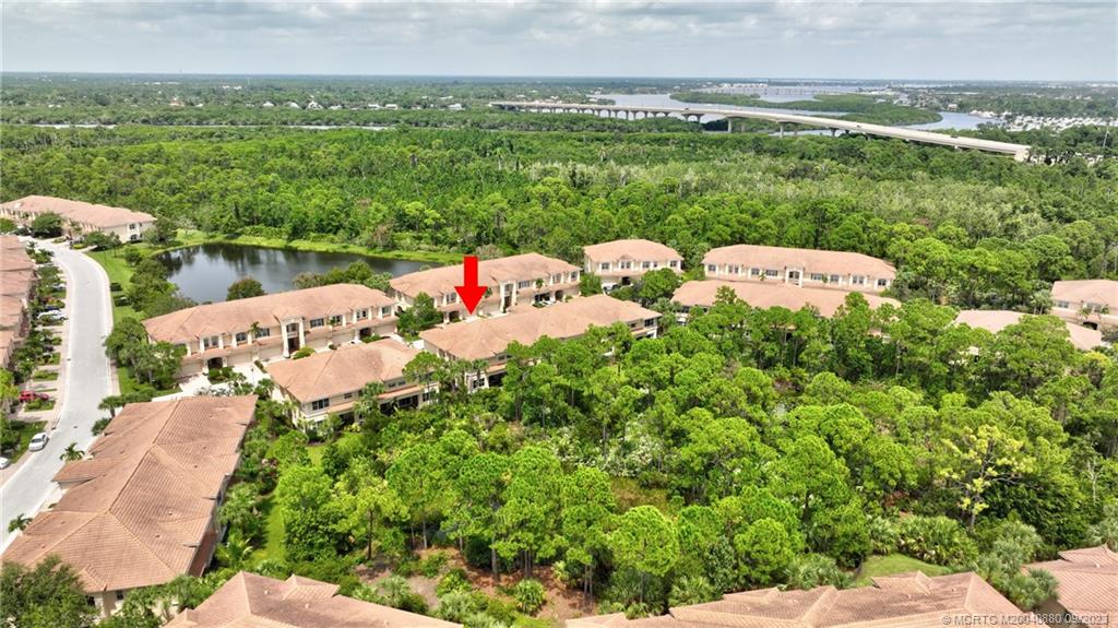 316 Southwest Otter Run Place Stuart, FL 34997 - Photo 45 of 50 a view of a garden with lawn chairs