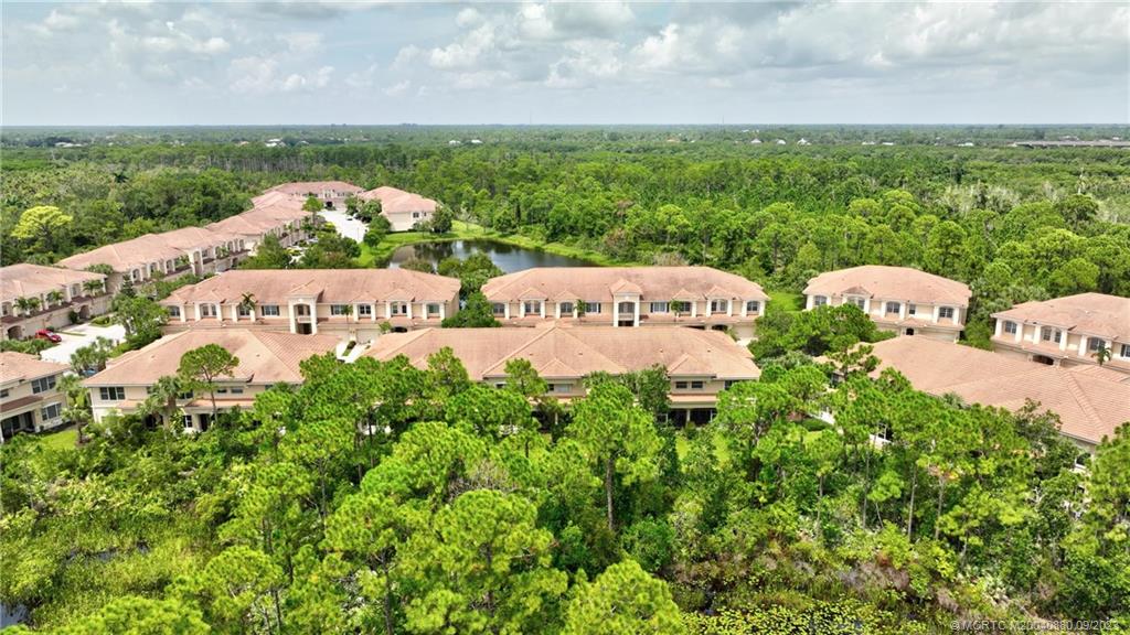 316 Southwest Otter Run Place Stuart, FL 34997 - Photo 47 of 50 a view of a bunch of trees and grassy field