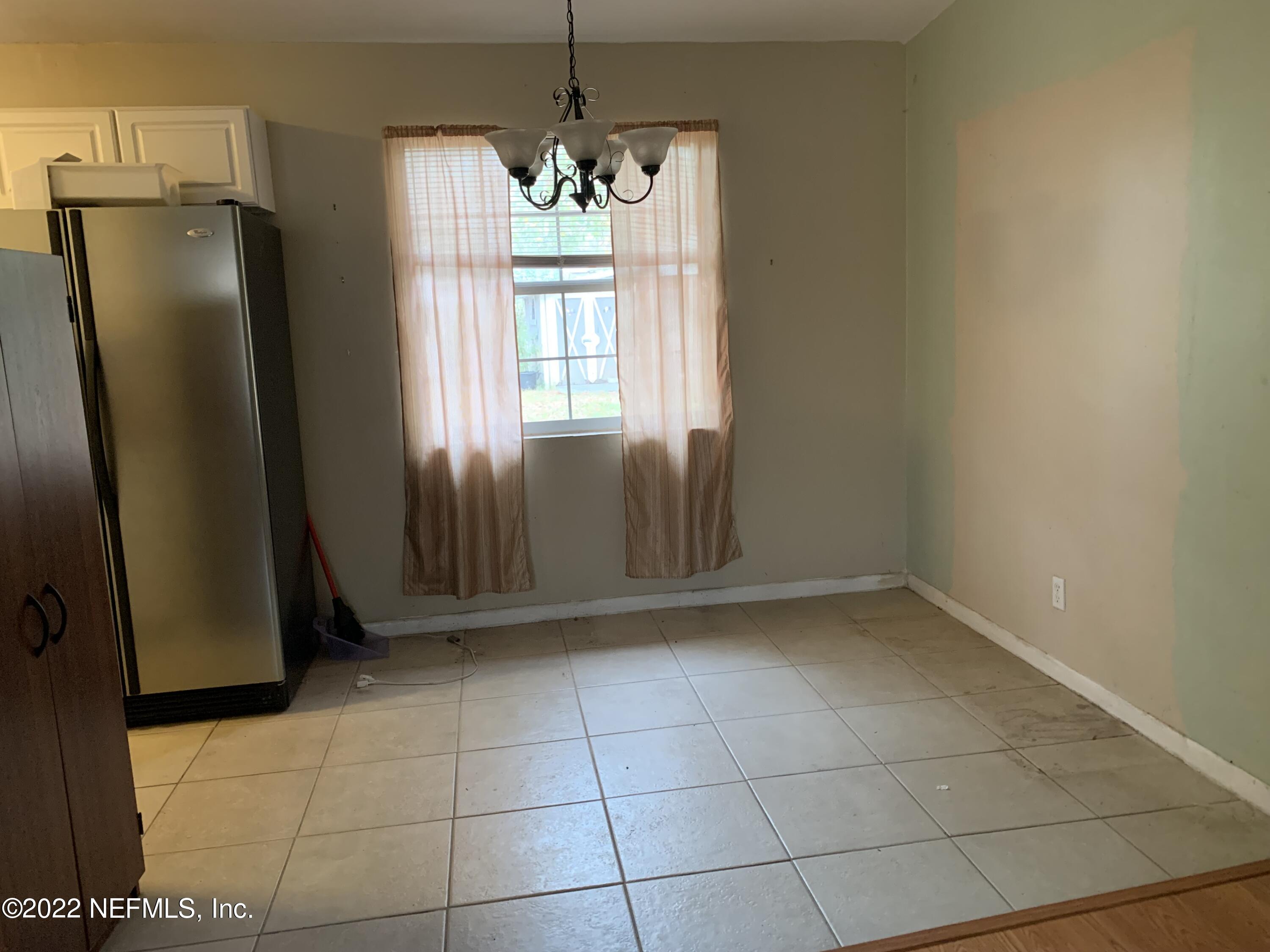 7014 Rollo Road Jacksonville, FL 32205 - Photo 12 of 21 a view of an empty room with a window