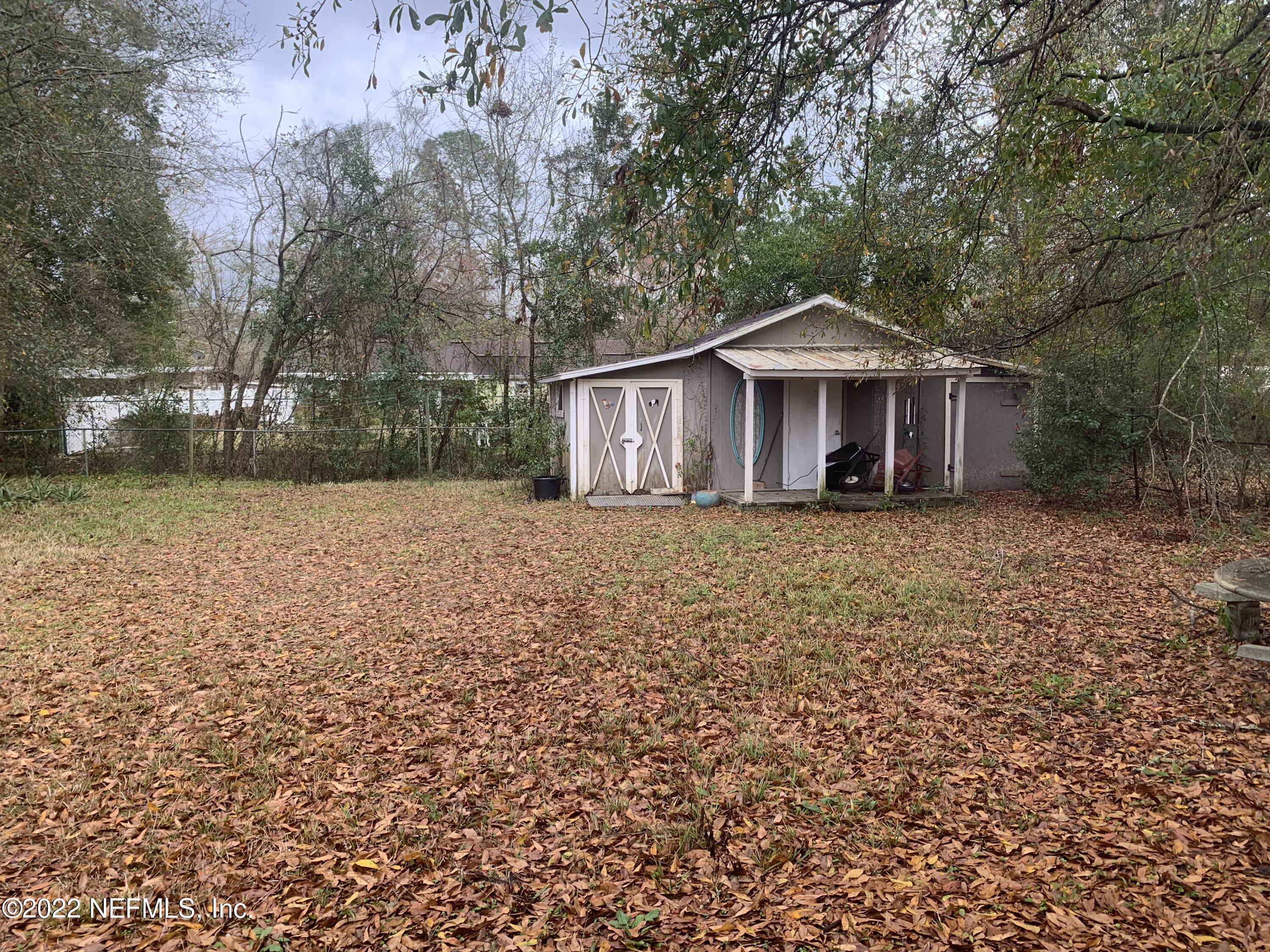 7014 Rollo Road Jacksonville, FL 32205 - Photo 18 of 21 a front view of a house with a garden