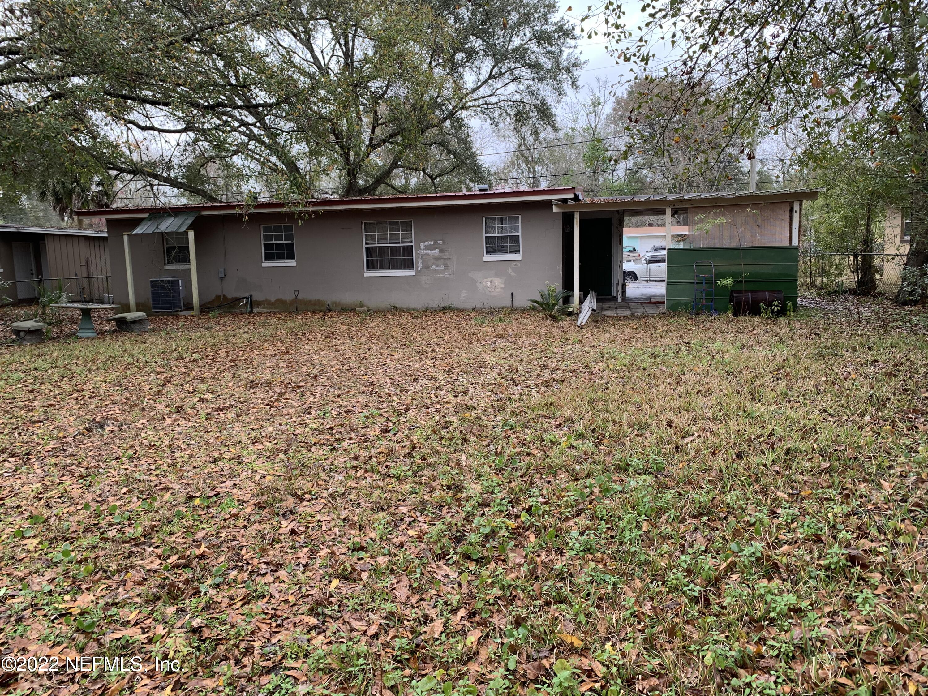 7014 Rollo Road Jacksonville, FL 32205 - Photo 21 of 21 a front view of house with yard and trees in the background