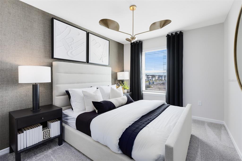 11483 Harborview Street Orlando, FL 32832 - Photo 20 of 26 a bedroom with bed and a night stand next to a window