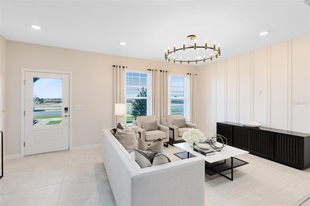 11483 Harborview Street Orlando, FL 32832 - Photo 7 of 26 a living room with furniture and a large window