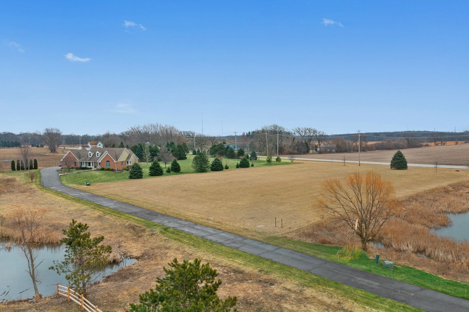 2 Stonecrest Drive Elgin, IL 60124 - Photo 7 of 10 a view of a lake with houses in the back