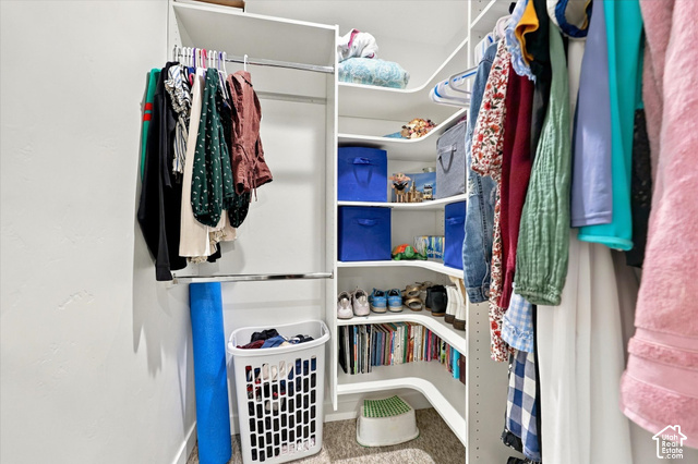 972 Vine Street Mapleton, UT 84664 - Photo 24 of 40 Built-in closet system featuring multiple shelves, two hanging rods, and corner shelving