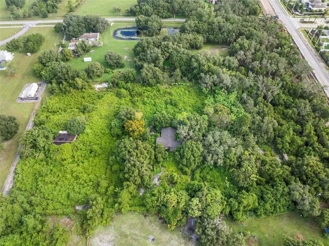 a view of a garden with a house