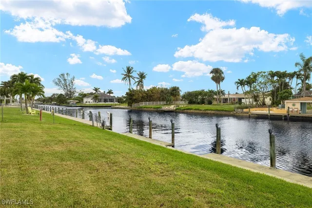 a view of a lake with houses in the back