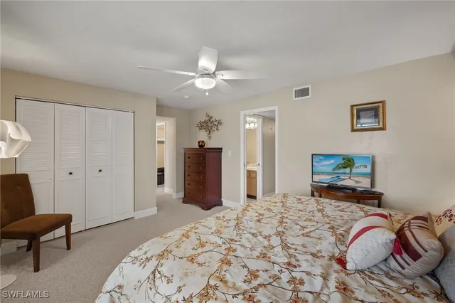 a bedroom with a bed and a couch