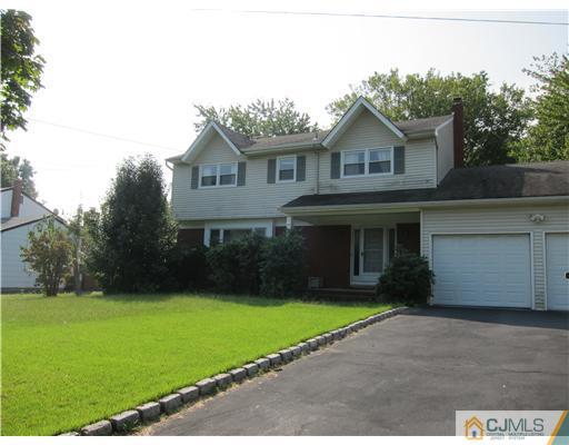 3 Baltic Street Edison, NJ 08820 - Photo 1 of 16 a front view of a house with a garden and yard
