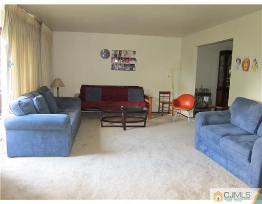 3 Baltic Street Edison, NJ 08820 - Photo 2 of 16 a living room with furniture and a couch