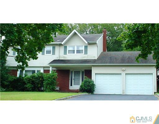 3 Baltic Street Edison, NJ 08820 - Photo 14 of 16 a front view of a house with a yard and garage