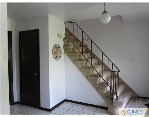 3 Baltic Street Edison, NJ 08820 - Photo 7 of 16 a view of entryway and hall with a front door