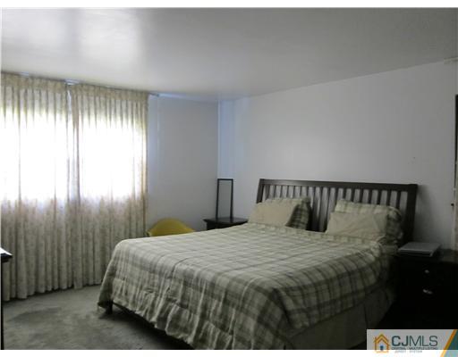 3 Baltic Street Edison, NJ 08820 - Photo 8 of 16 a bedroom with a bed and a window
