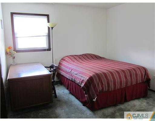 3 Baltic Street Edison, NJ 08820 - Photo 9 of 16 a bedroom with a bed and window